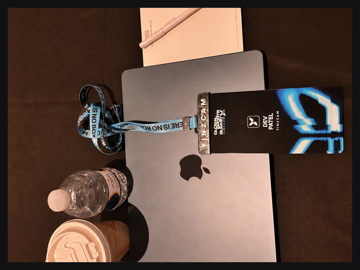 The badge and the laptop the client builds go out from.